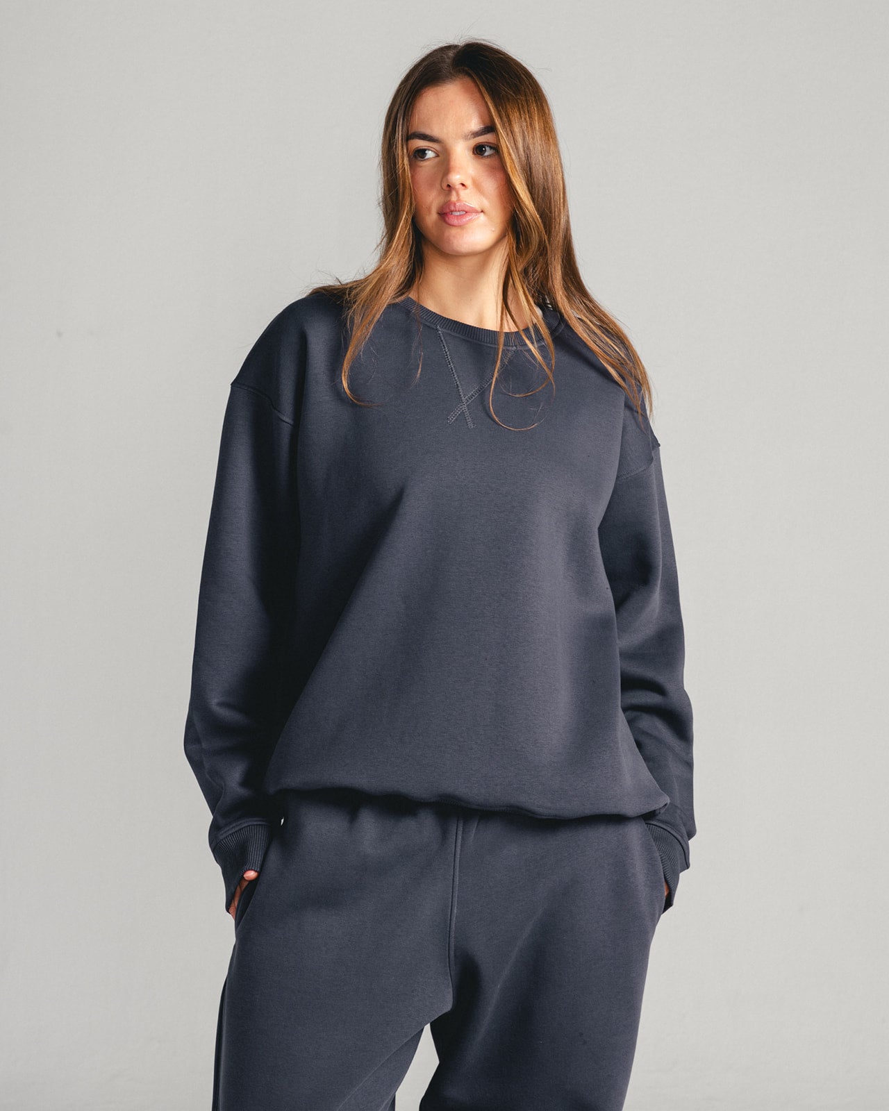 Charcoal Grey Core Fleece Crewneck on female model